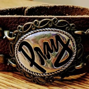 Leather cuff with pray pendant